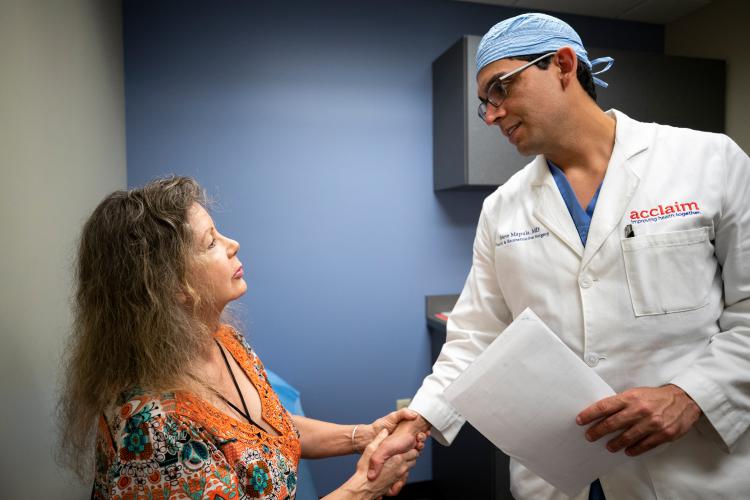 Dr. Steven Mapula with a patient.