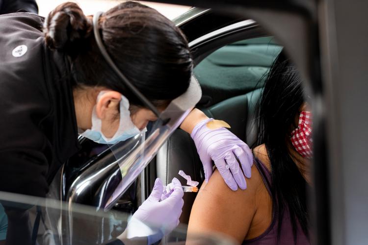 Patient receiving flu shot at a JPS drive-thru clinic.