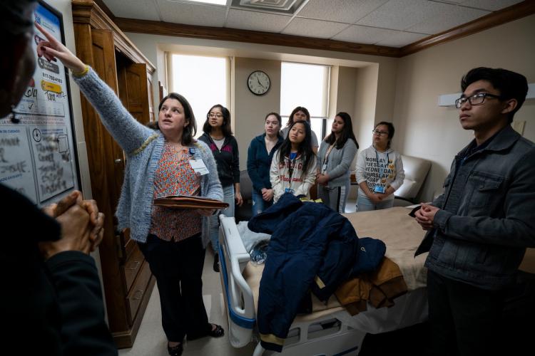 Jana Thompson, MSN, RN, gives OD Wyatt High School student volunteers a tour of a patient room