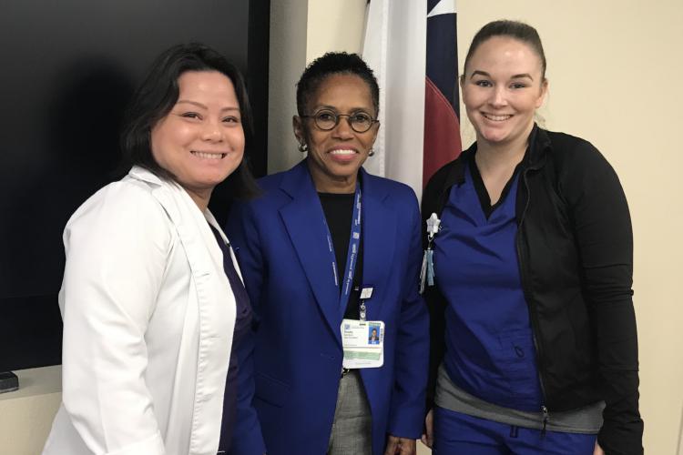 RNs Christi Nguyen (L) and Ashley Hall (R) accept a Good Catch Award from Vice President of Patient Care Trudy Sanders (center) on behalf of T3 Nurses.