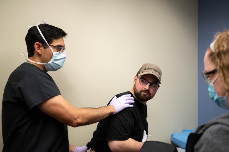 Dr. Steven Mapula, a plastic surgeon, examines Alex Ramsaier at the Ben Hogan Clinic in Fort Worth Texas.