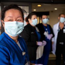 JPS Health Network Nurses wear their masks as the await patients at a COVID screening checkpoint