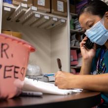 Dr. Jocelyn Zee, 2000 Acclaim Physician Group Physician of the Year, works in the personal protective equipment dressing area at JPS Health Network.