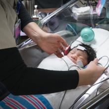 Infant receiving hearing test