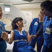 RN Minsuh Bae, from left, chats with former JPS patient Teryl Dorham, RN Team Sylvia Baker and RN Clinical Manager Daphne Young before a radiology appointment.
