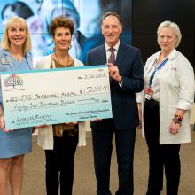 Representatives of the Jordan Elizabeth Harris Foundation deliver a donation for suicide prevention research to JPS Health Network on Tuesday, March 26, 2019 in Fort Worth, Texas.