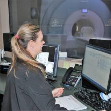 MRI Technician Amber Adam gets ready to scan a patient