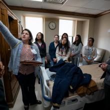 Jana Thompson, MSN, RN, gives OD Wyatt High School student volunteers a tour of a patient room