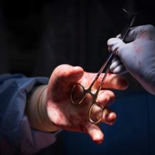 Surgeons handling tools