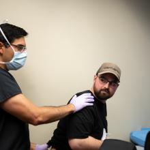 Dr. Steven Mapula, a plastic surgeon, examines Alex Ramsaier at the Ben Hogan Clinic in Fort Worth Texas.